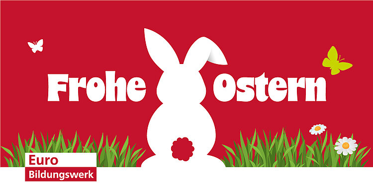 Zentral steht eine weiße Silhouette eines sitzenden Hasen mit rotem Schwanz vor rotem Hintergrund. Links und rechts vom Hasen steht in großen, weißen Buchstaben der Schriftzug 'Frohe Ostern'. Im unteren Bereich wachsen grüne Grashalme, Gänseblümchen und zwei gelbe Schmetterlinge fliegen. Unten links befindet sich ein weißes Rechteck mit rotem Rand, darin steht in roter und weißer Schrift 'Euro Bildungswerk'.